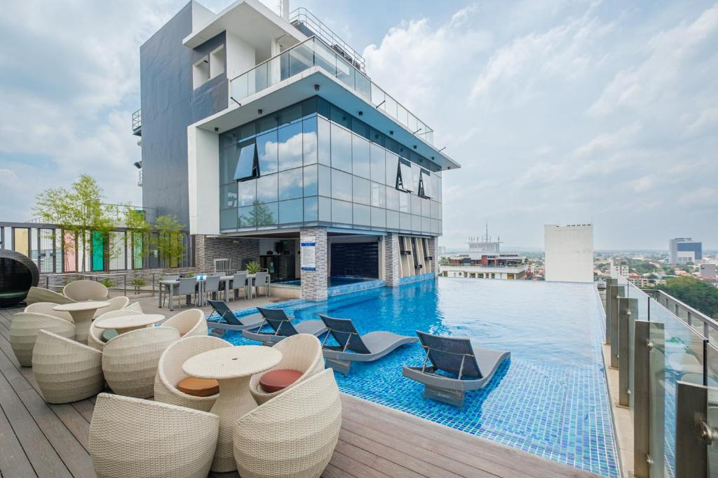 One Euphoria glazed hotel facade beside a rooftop pool